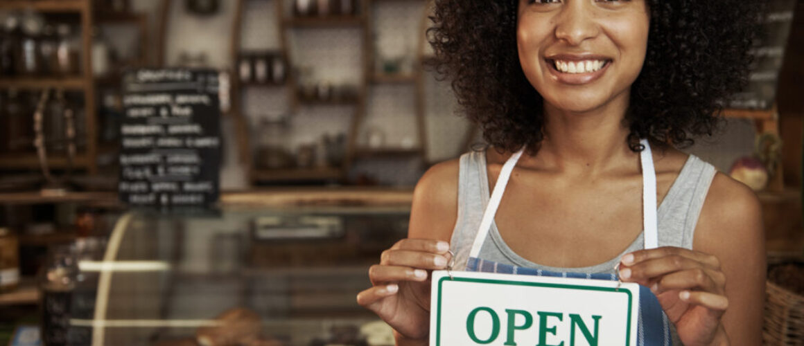 woman-holding-open-sign